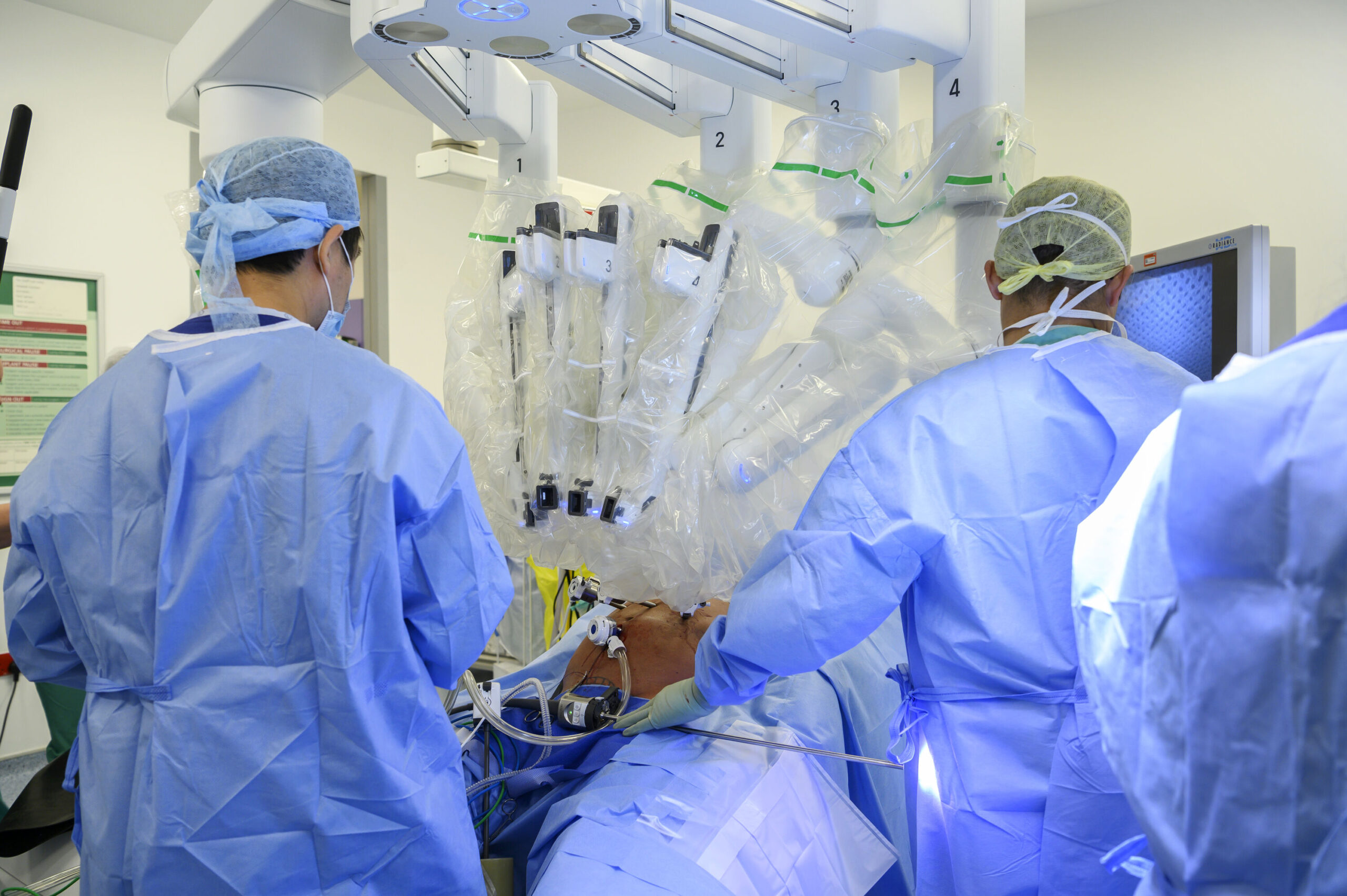 Surgons using the robot equipment during surgery